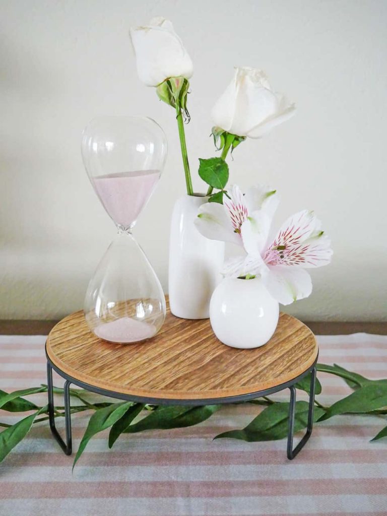 Quick and easy Mother's Day centerpiece with pink sand hourglass