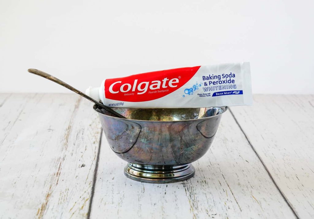 Toothpaste with silver bowl and spoon