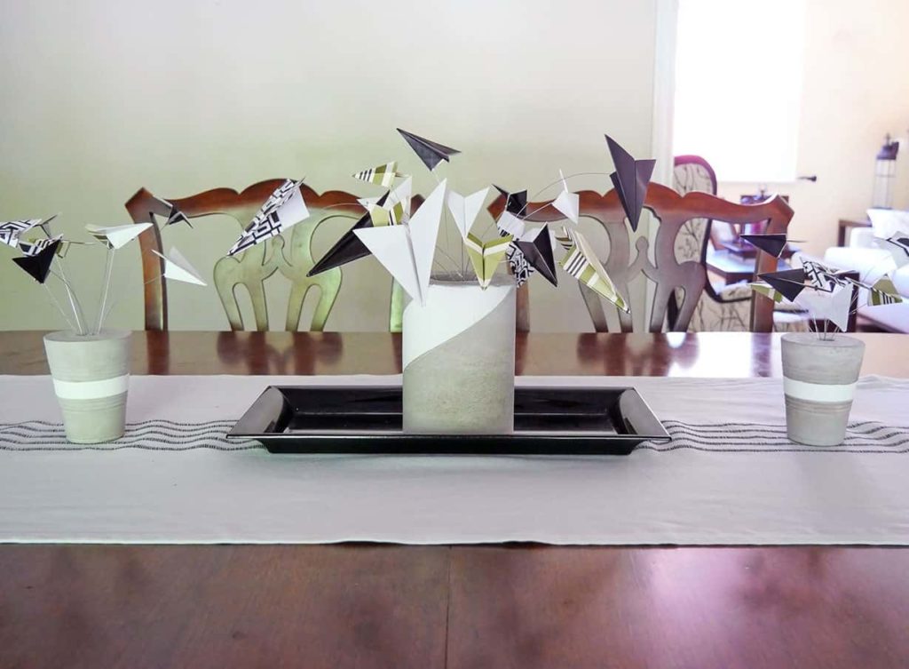 Vases with paper airplanes on Father's Day tablescape