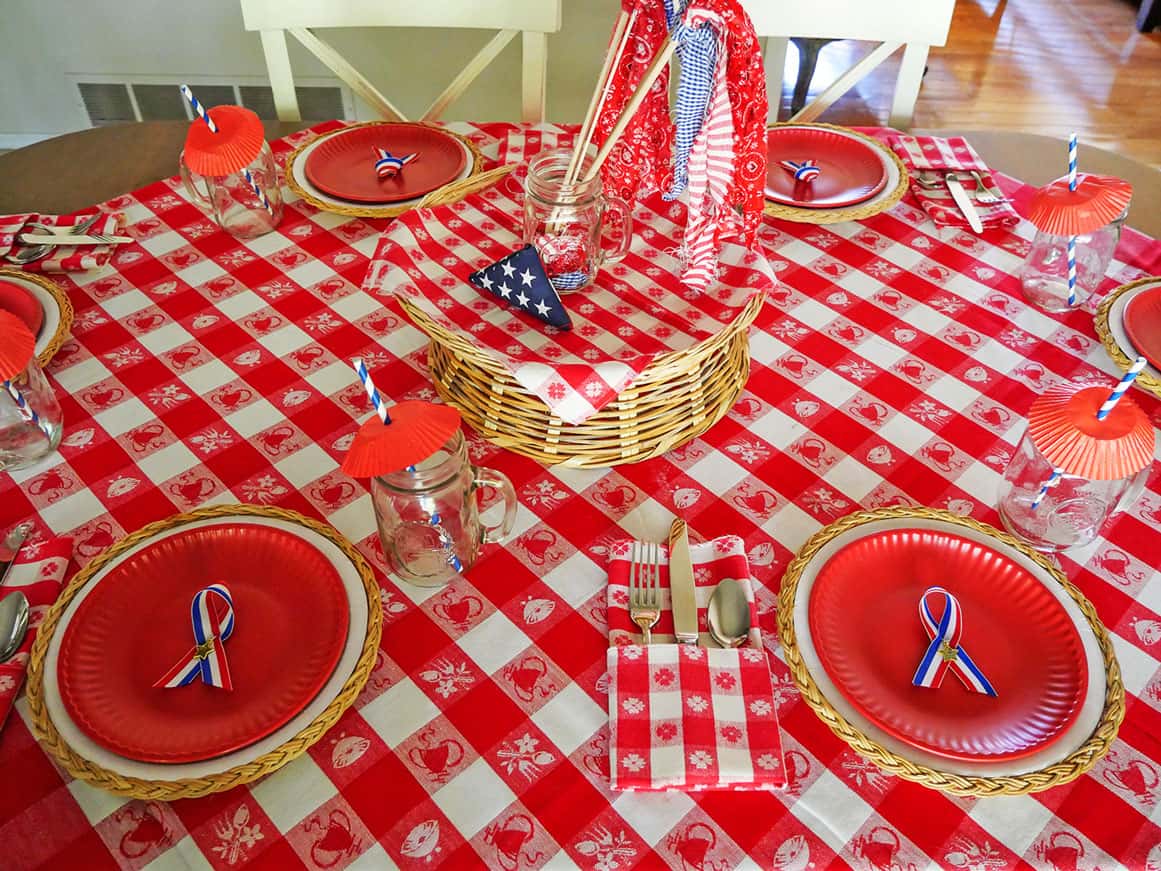 Flag and mason jar added to Memorial Day table setting centerpiece