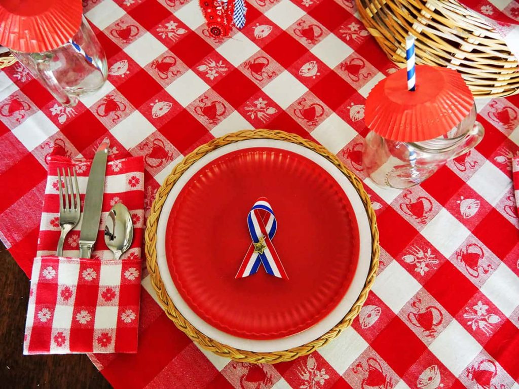 Overhead view of patriotic pin on place setting