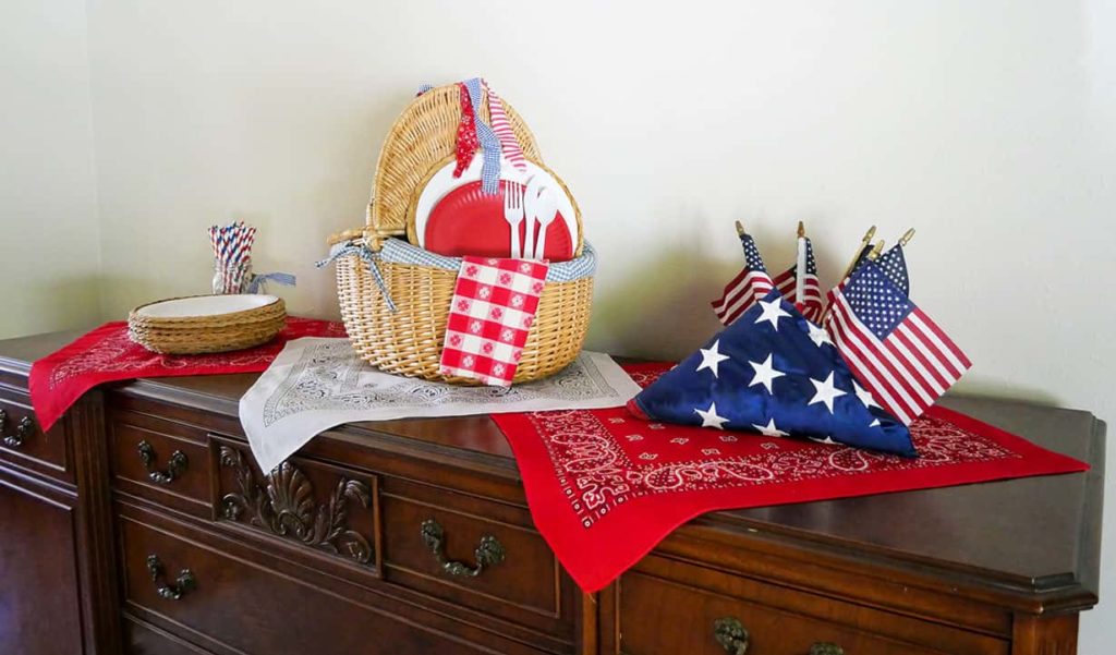 Sideboard decorated to match Memorial Day table setting