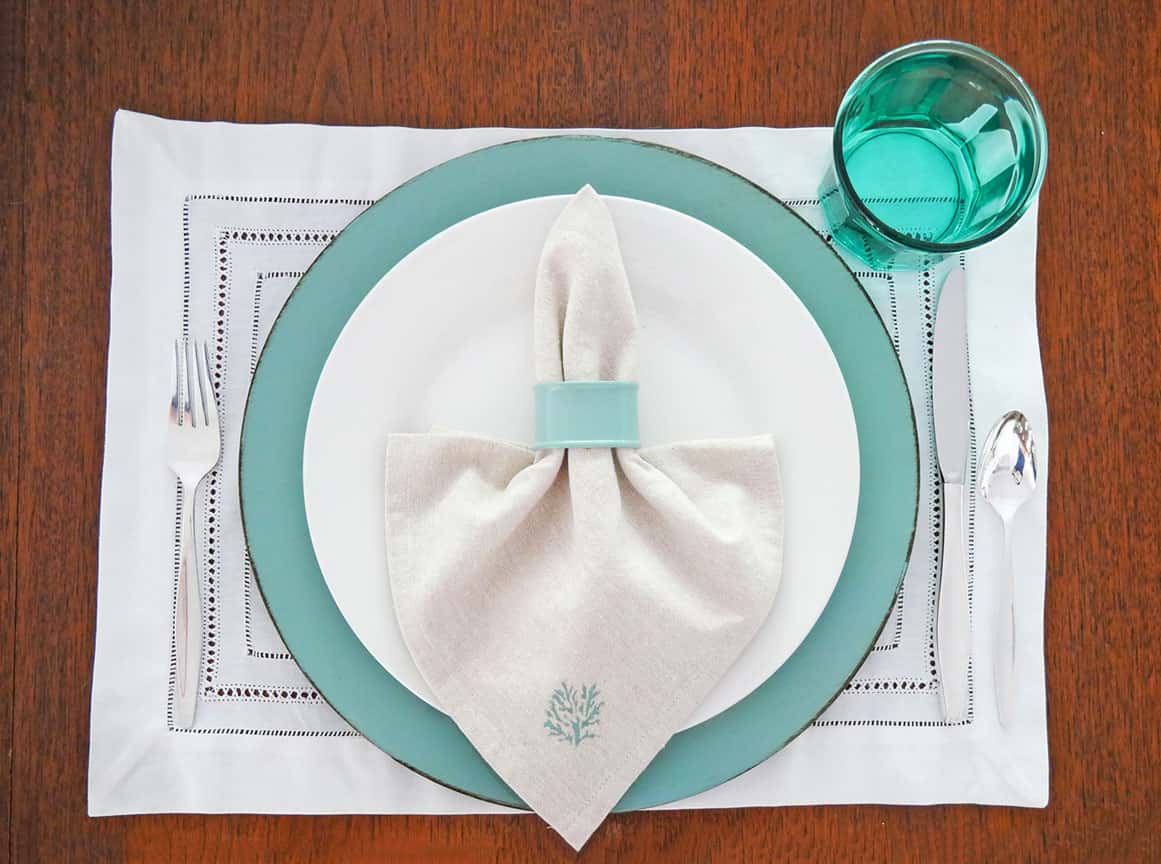 Coastal grandmother place setting with white placemat