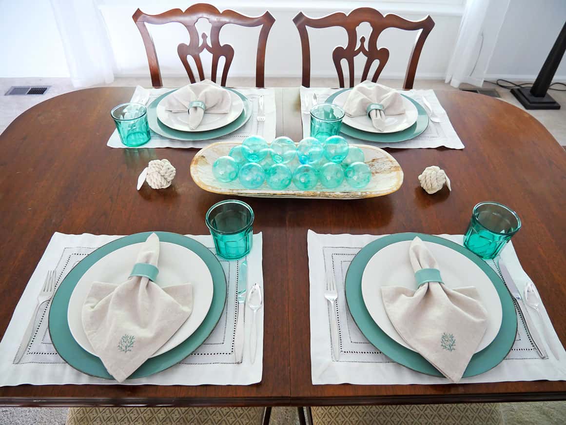 Coastal grandmother table setting using white placemats