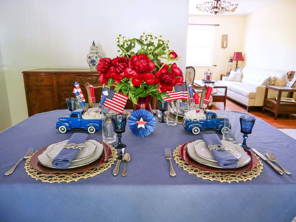 Paper rosette added to festive 4th of July table setting centerpiece