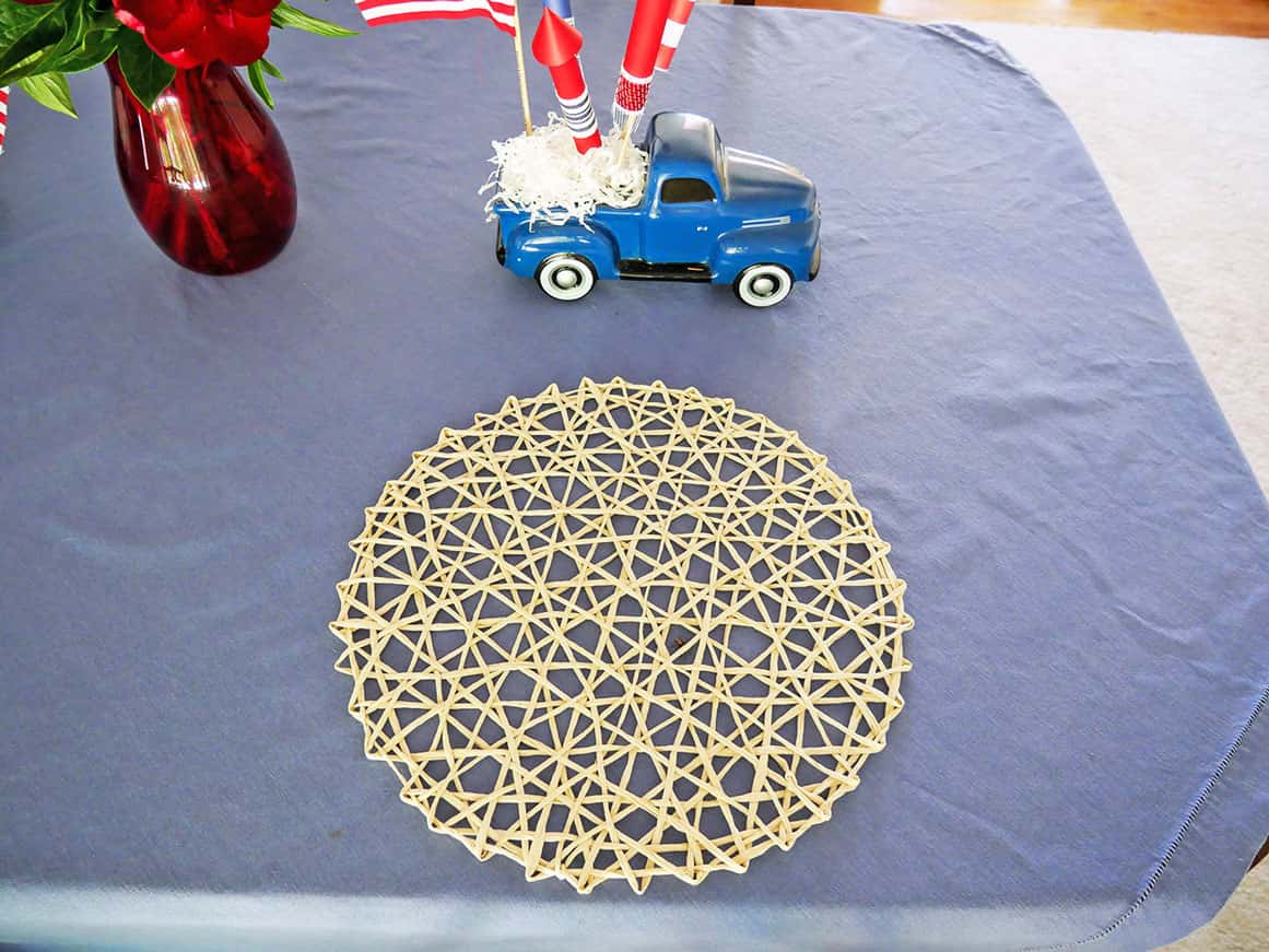 Light cream placemat on blue tablecloth