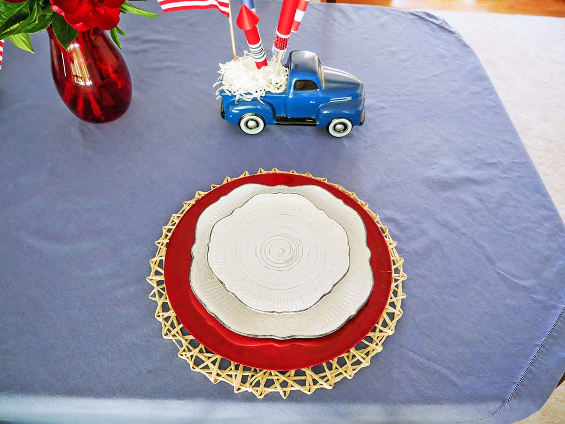 Plates added to festive 4th of July table setting