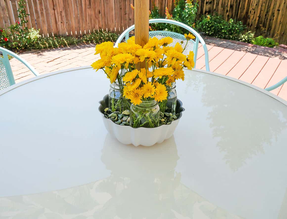 Easy DIY Centerpiece for an Umbrella Table with flowers