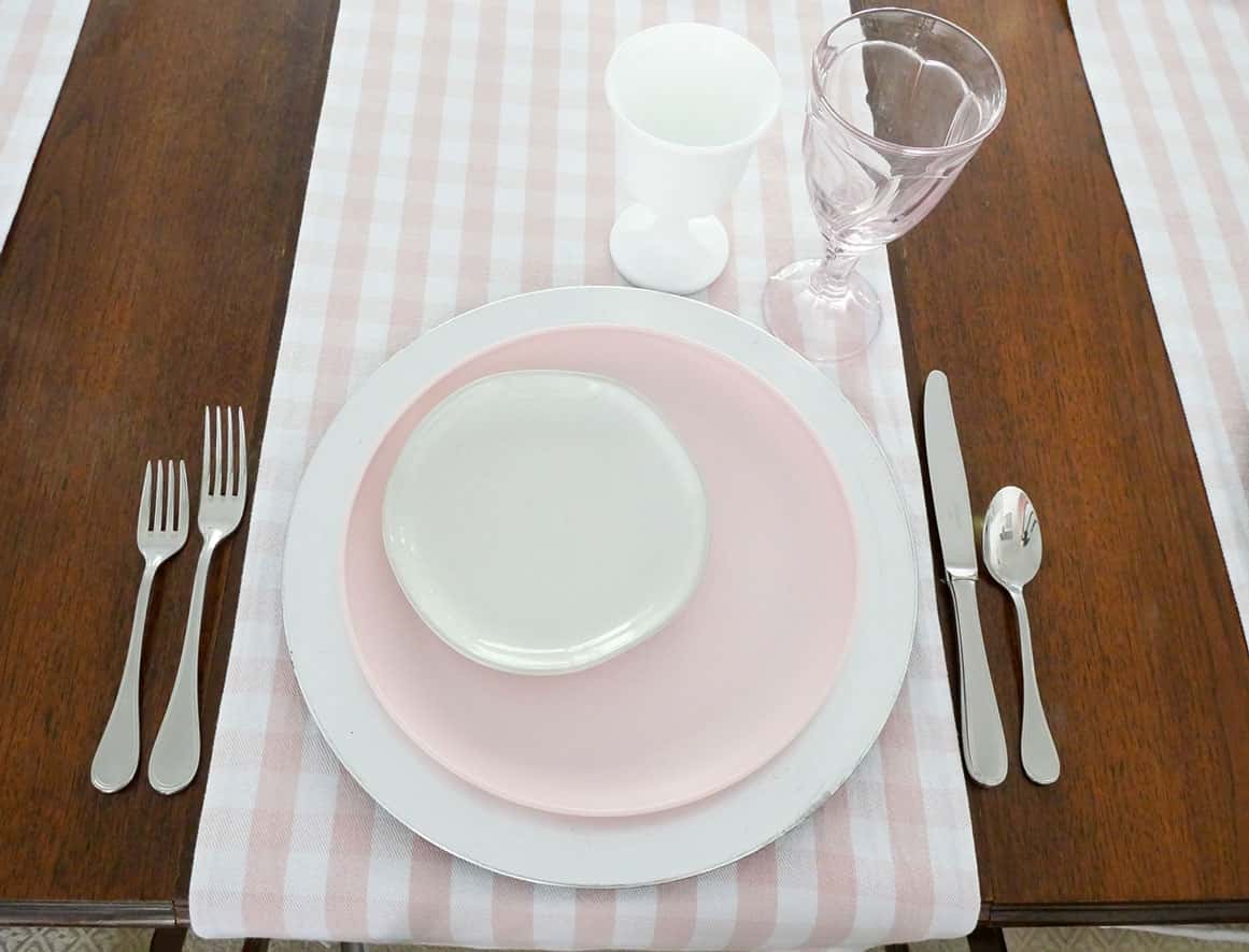 Pink and white drinking glasses added to lunch place setting