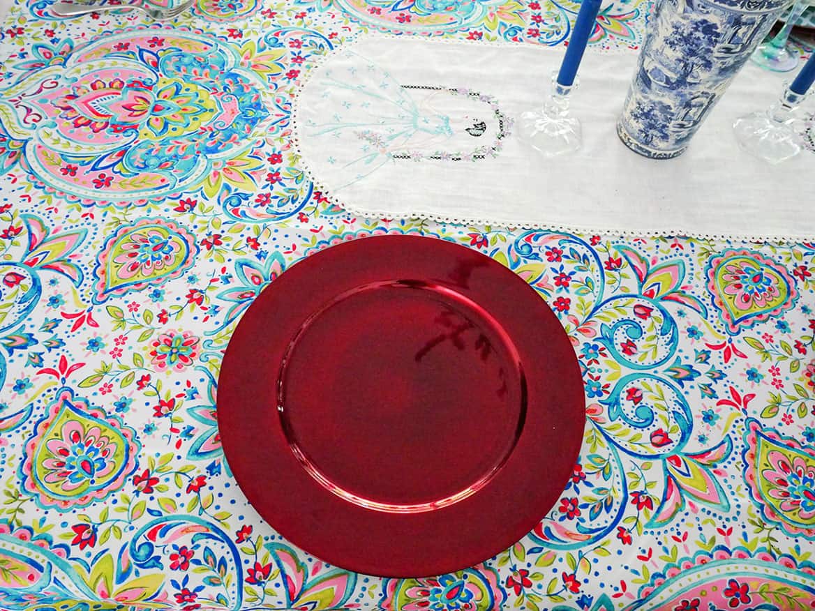 Red charger on cute Grandmillenial table setting