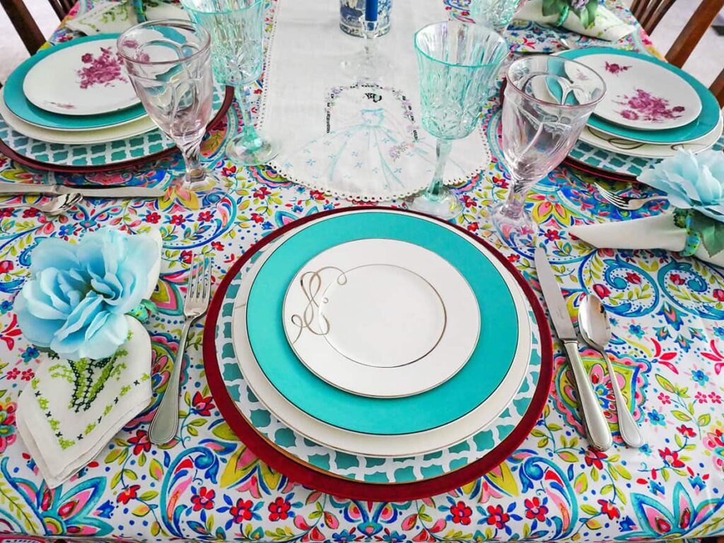 Place setting with white salad plate on top