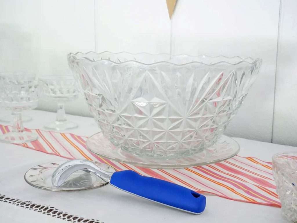 Glass punch bowl and ice cream scooper