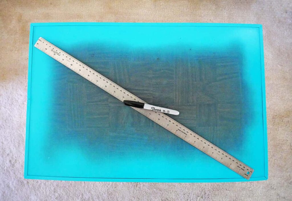 Ruler used to find middle of the tray
