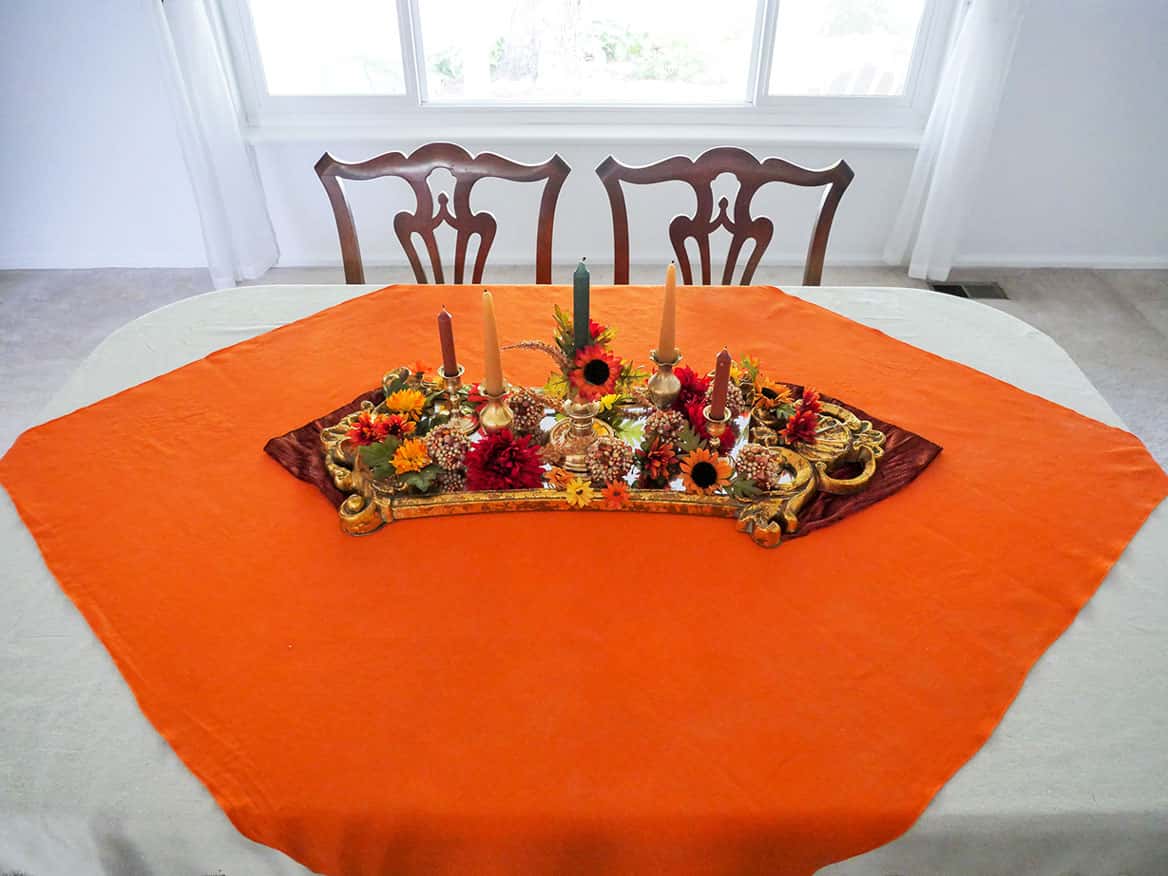Fake flowers added to 1970s vintage fall tablescape centerpiece