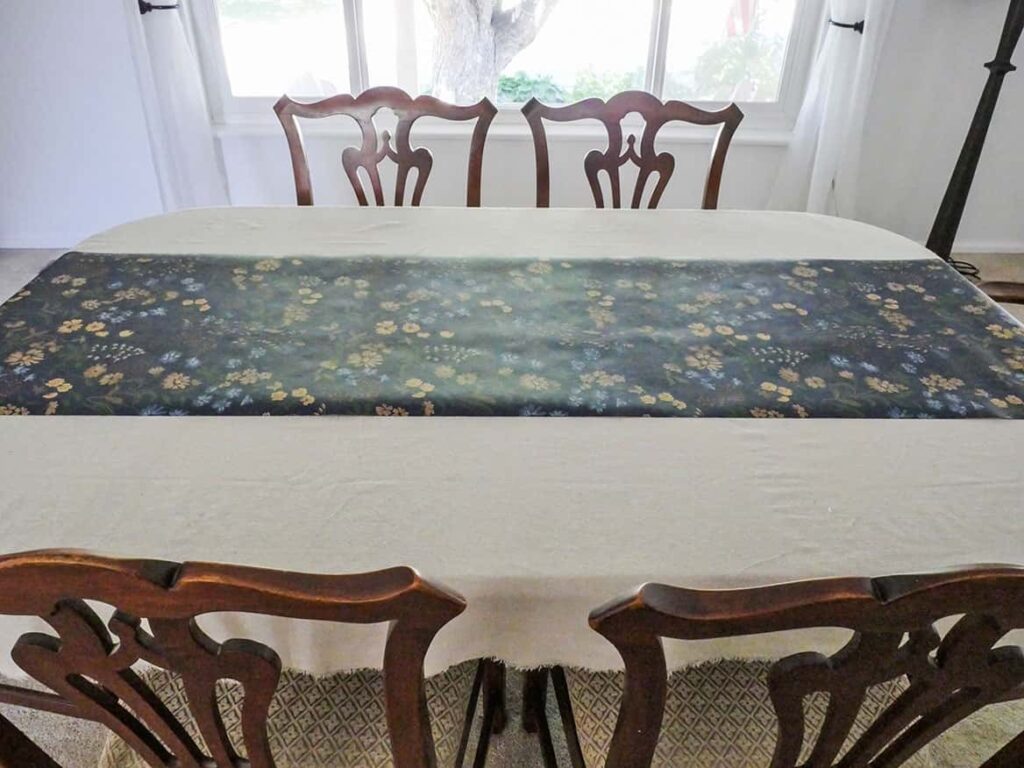 Wallpaper used as table runner on simple cozy Fall table setting