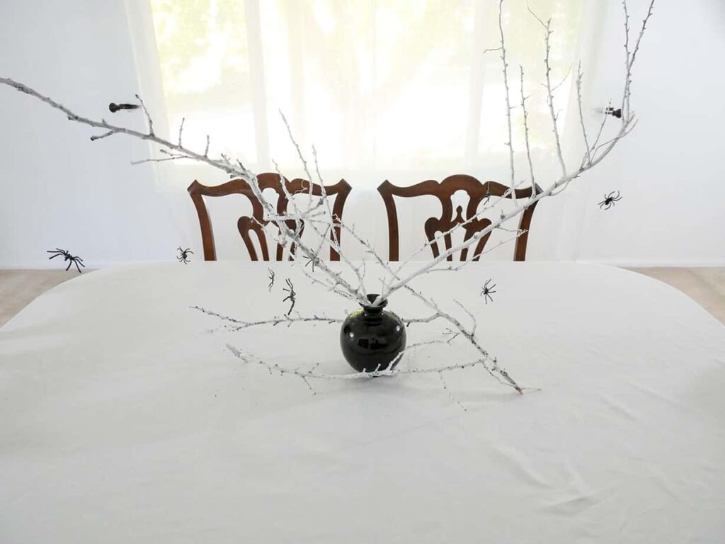 Spider Halloween table setting centerpiece with hanging spiders