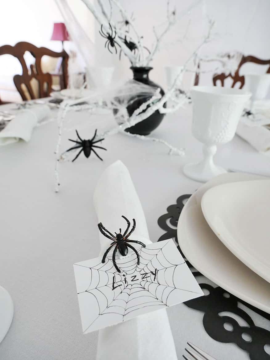 Spider Halloween table setting with lots of spiders