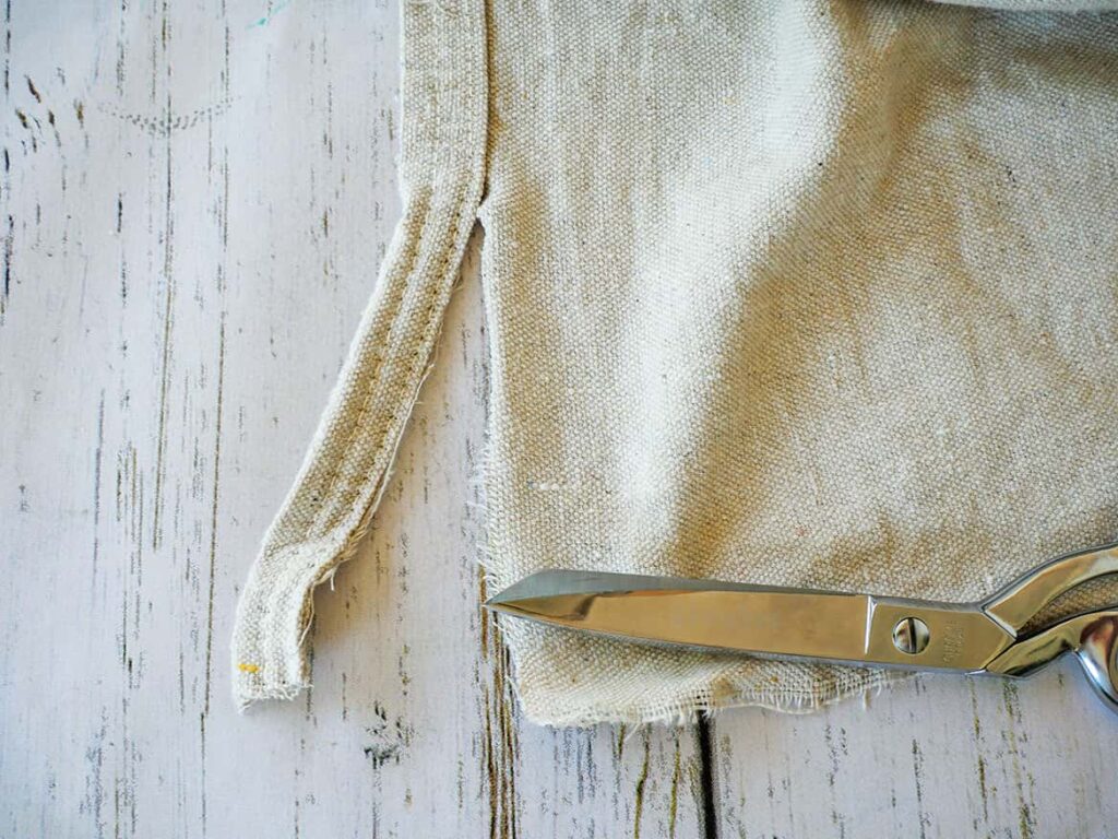 Cutting seam off easy no sew diy drop cloth napkins.