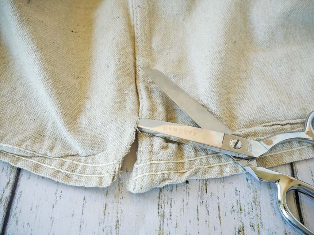 Cut an inch up drop cloth to tablecloth DIY