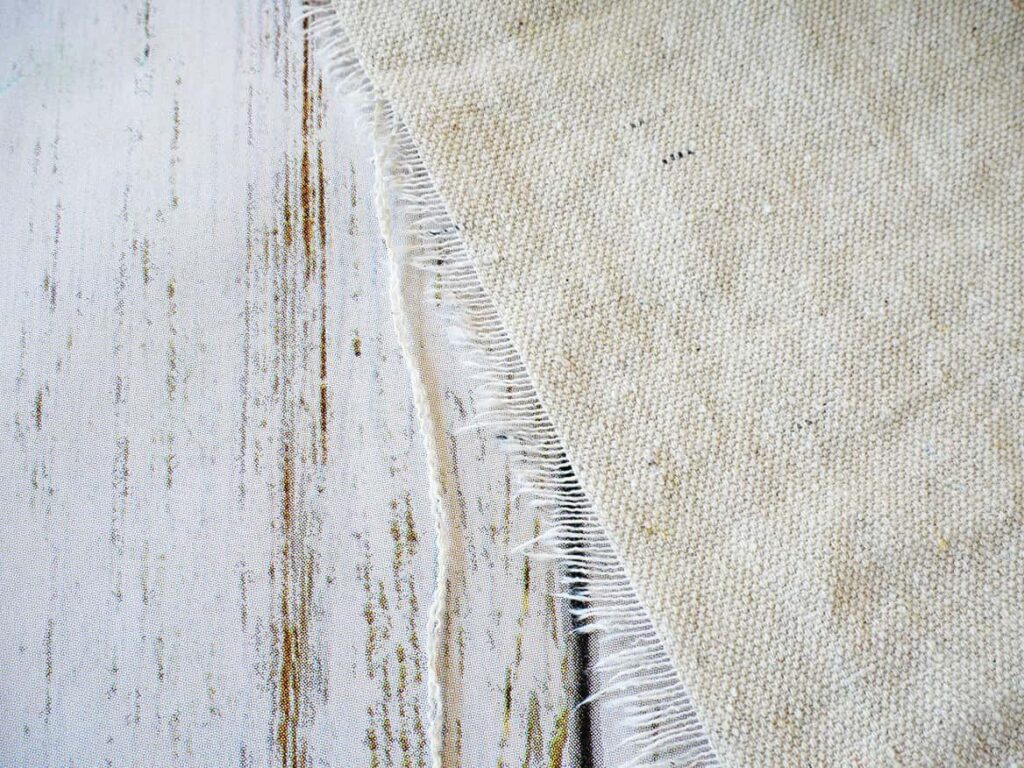 Pull threads from edge of drop cloth to tablecloth DIY