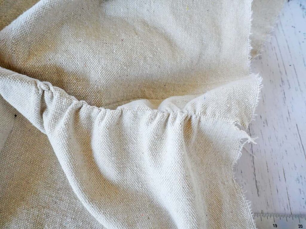Pulling thread thru easy no sew diy drop cloth napkins
