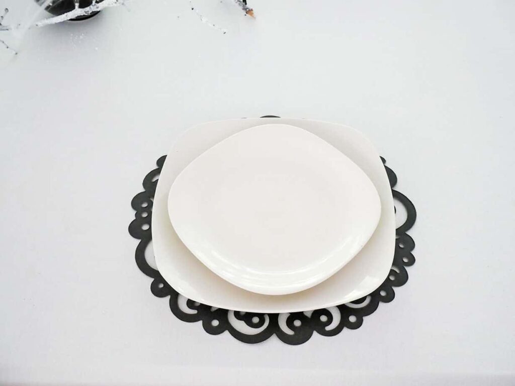 Plates added to Spider Halloween table setting