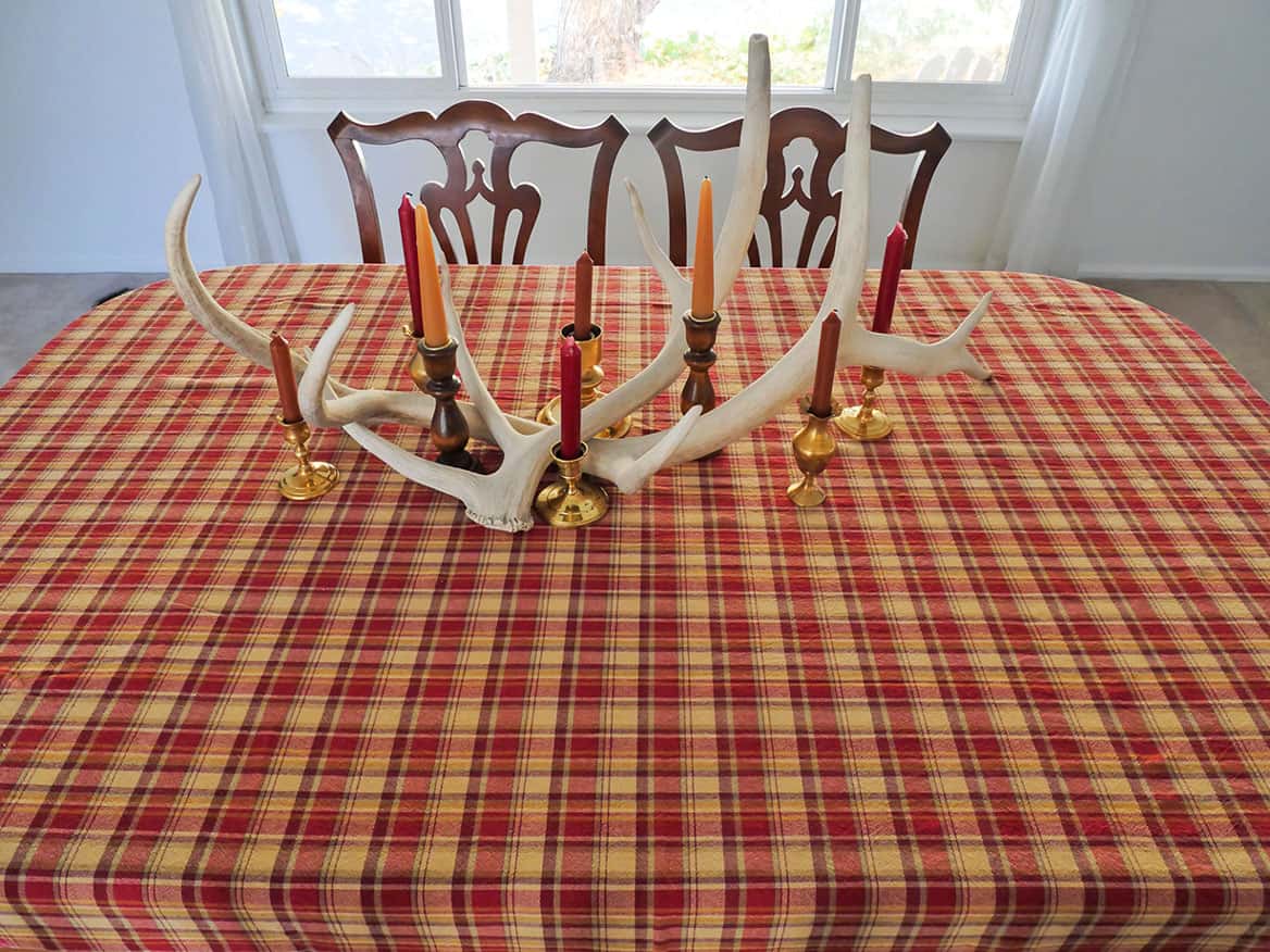 rAntlers and candles on Rustic Thanksgiving tablescape