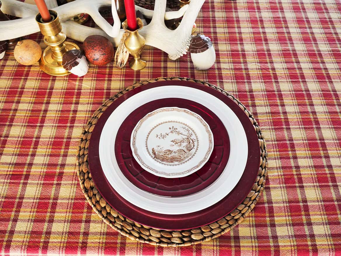 Brown and white plate on top of red salad plate