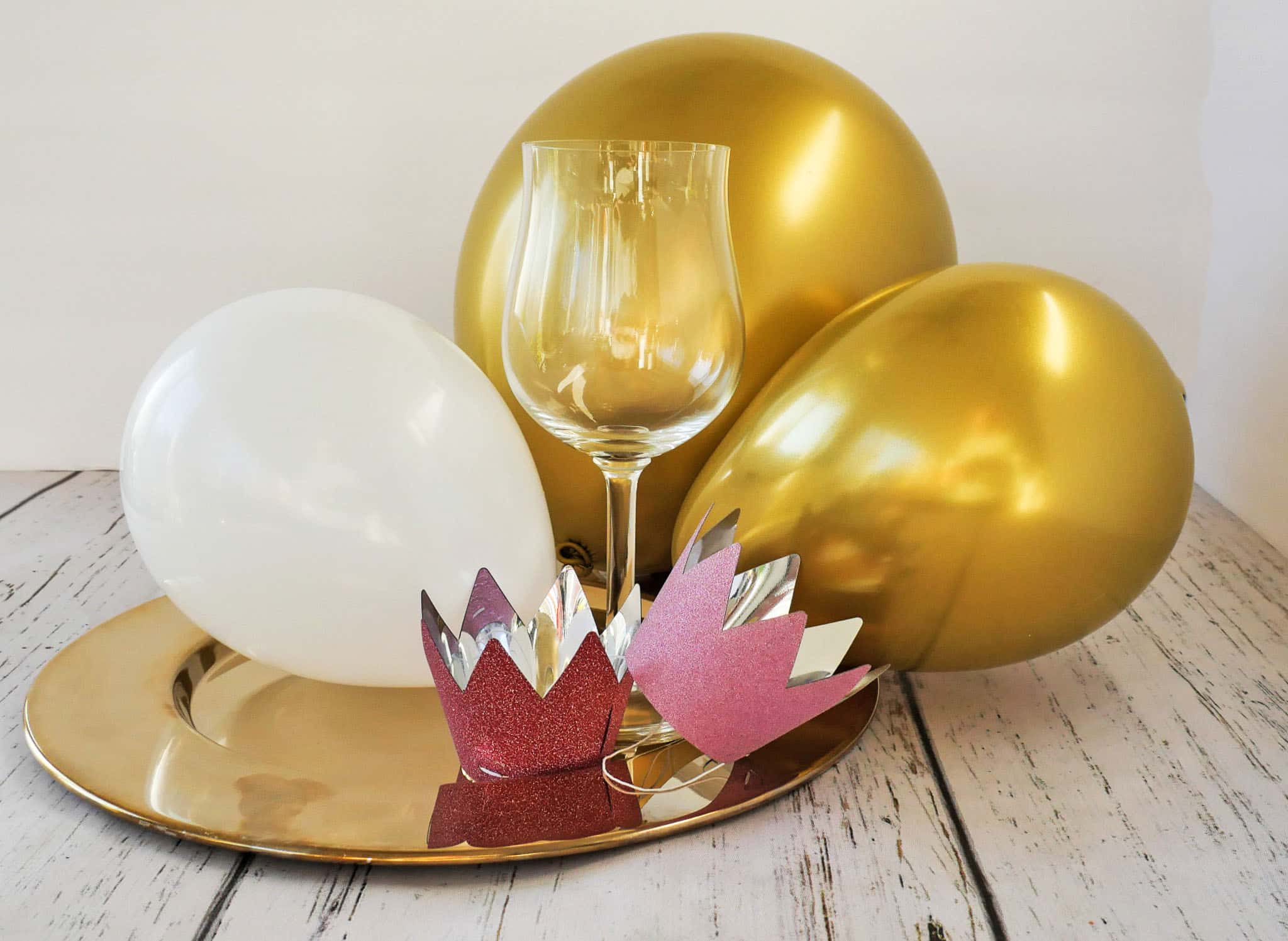 Balloons and wine glass on tray
