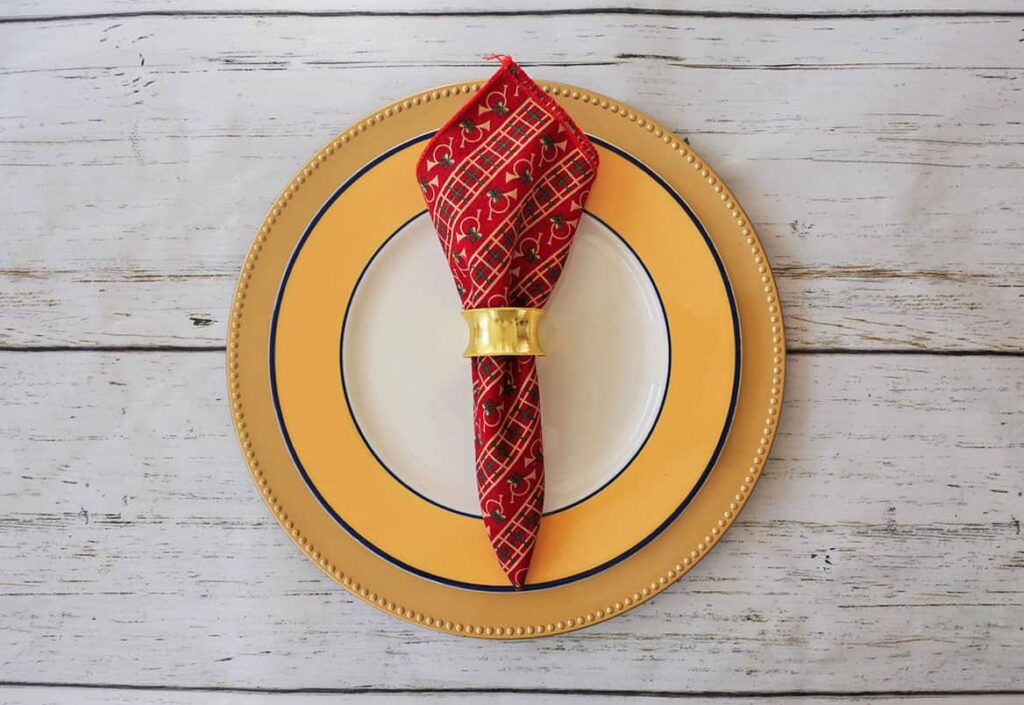 Festive Christmas place setting without Christmas plates using gold napkin ring