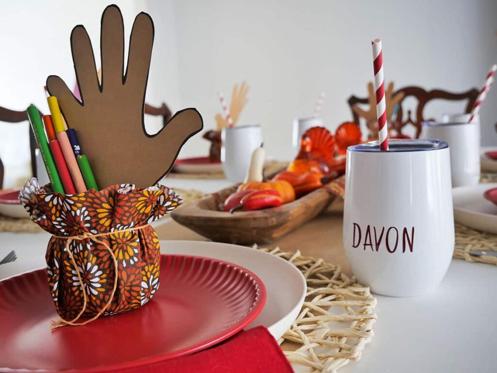 Kids pencils and cup on Kids Thanksgiving Day table
