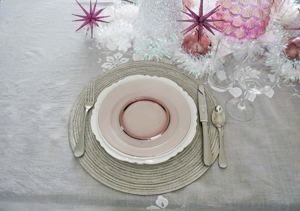 Flatware and glasses added to place setting