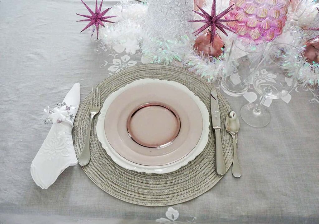 White napkin and diy snowflake napkin ring added to place setting
