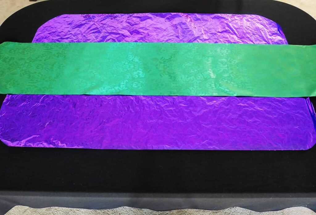 Green table runner added to Budget Mardi Gras Tablescape