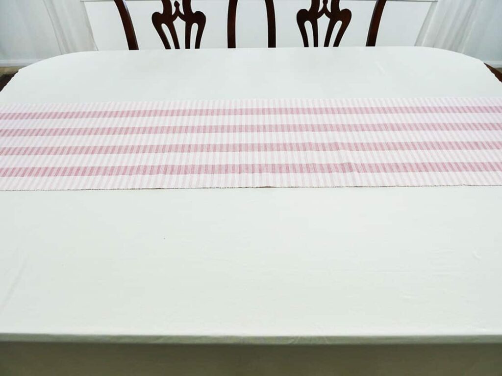 Two-tone pink table runner on Galentine's Day table setting