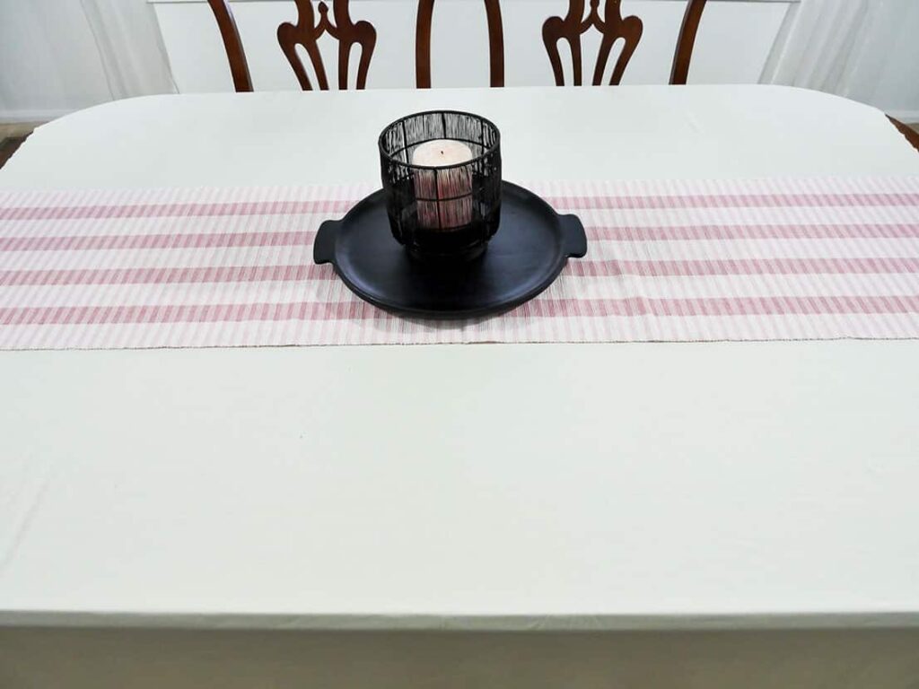 Candle holder added to Galentine's Day table setting