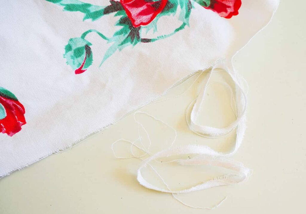 Tearing upcycle tablecloth into napkins