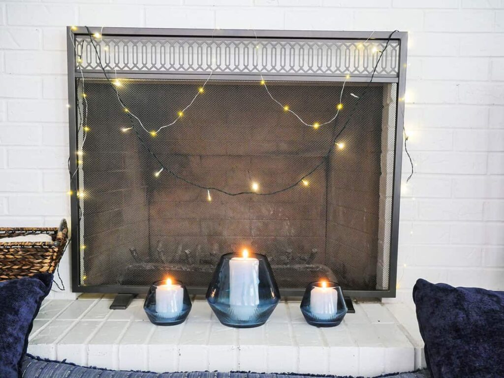 Candle holders moved to the fireplace hearth