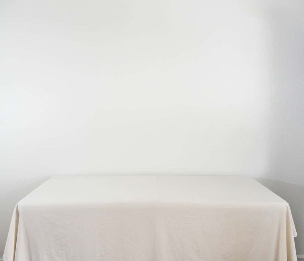 White sheet covering folding table