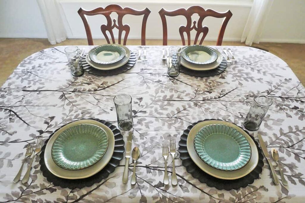 Thrifted table setting with flatware and glasses added