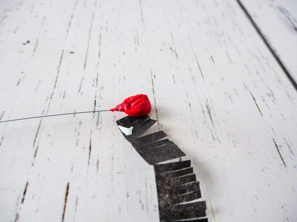 DIY red poppy napkin rings black fringe wrap around ball