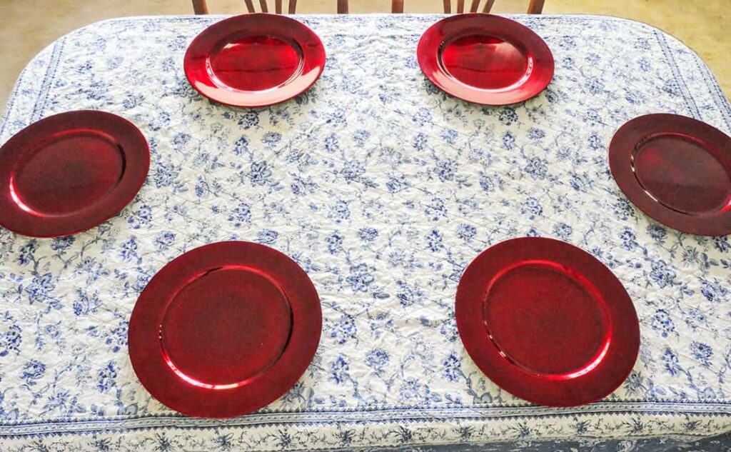 Simple Memorial Day Tablescape with red charger plates