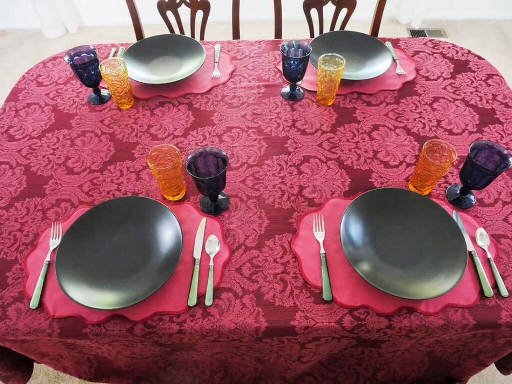 Father's Day table setting moody maximalism with flatware and glasses