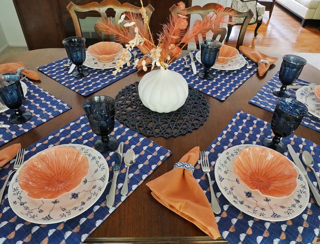 Simple Summer tablescape using blue, white and salmon colors.