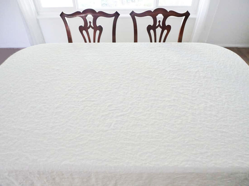 White tablecloth on apple harvest table setting