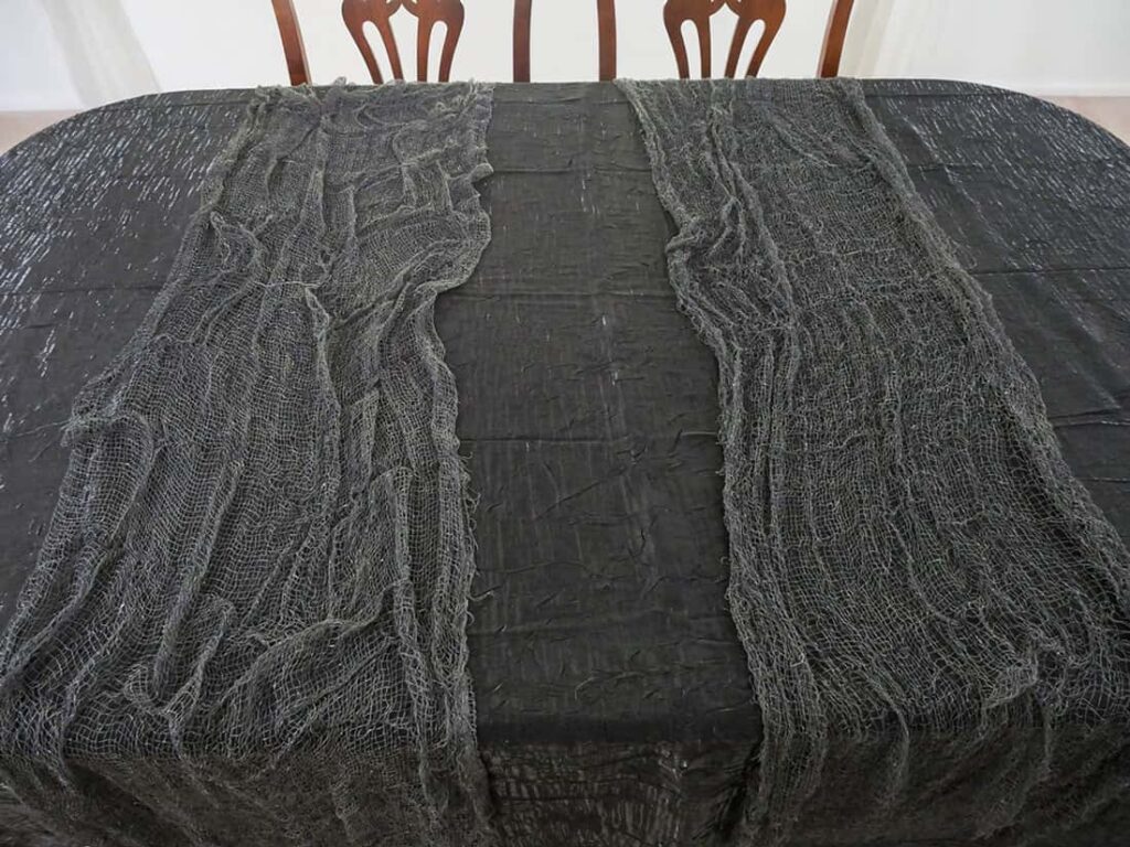 Creepy cloth on black tablecloth.