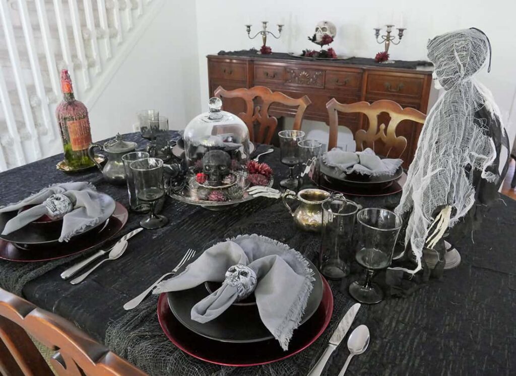 View of skeleton Halloween tablescape and buffet table.