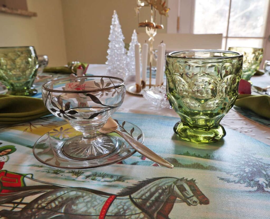 Vintage green glasses on Christmas table setting.