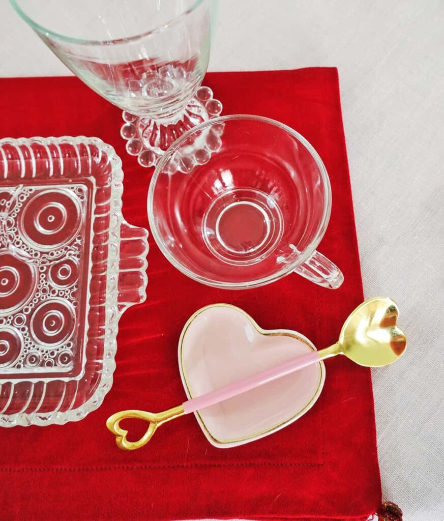 Close up of heart gifts on Galentine's Day tablescape.