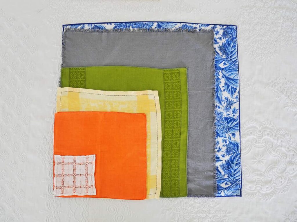 Different sized napkins on top of each other.